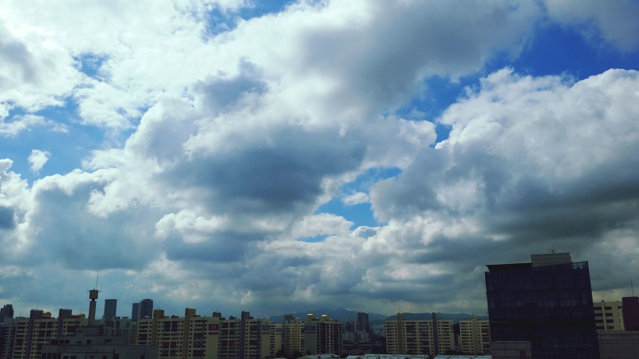 building exterior, sky, architecture, cloud - sky, built structure, city, cloudy, low angle view, cloud, cityscape, skyscraper, weather, building, modern, overcast, outdoors, residential building, day, no people, office building