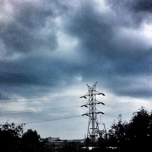 power line, electricity pylon, sky, electricity, power supply, low angle view, cloud - sky, connection, cloudy, fuel and power generation, cable, technology, silhouette, cloud, tree, overcast, weather, power cable, dusk, built structure