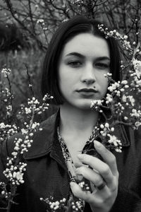 Portrait of woman with pink flowers