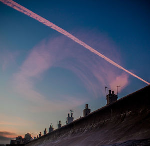 Low angle view of vapor trails in sky