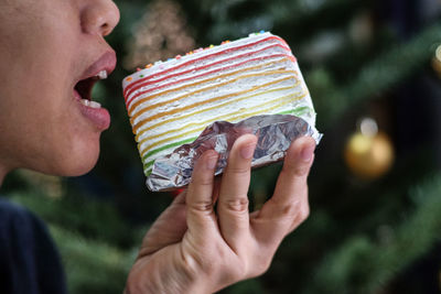 Close-up of woman eating cake