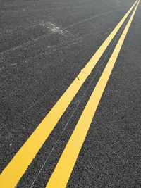 High angle view of double yellow line on road