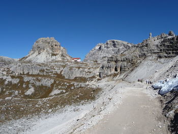 Low angle view of mountain against clear blue sky