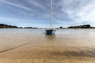 Boat in sea against sky
