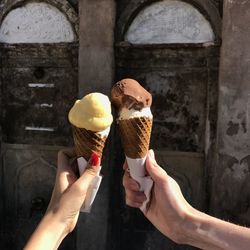 Cropped image of hand holding ice cream cone