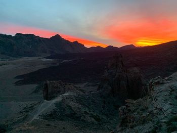 Scenic view of mountains against sky during sunset