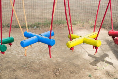 High angle view of colorful wooden suspension bridge at park