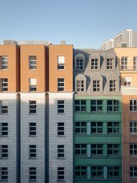 Low angle view of buildings against blue sky