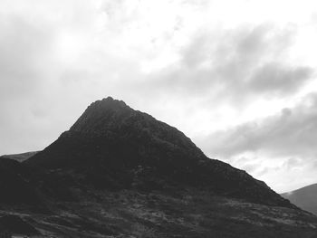 Low angle view of mountain range against sky