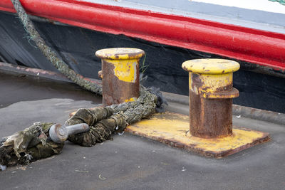 High angle view of ropes tied on metal