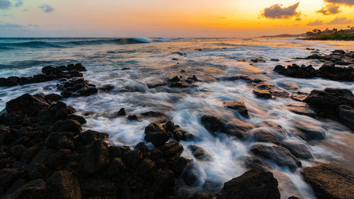 Scenic view of sea against sky during sunset