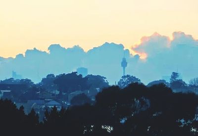 Scenic view of mountains against sky at sunset