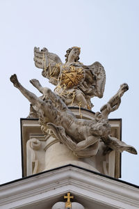 Low angle view of statue against sky