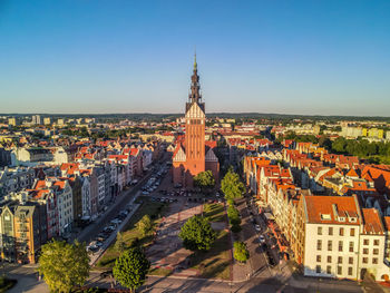 High angle view of buildings in city against clear sky