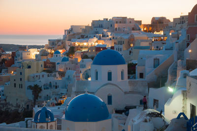 Classical whitewashed church and houses by sea