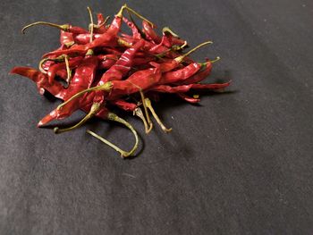 High angle view of red chili peppers on table