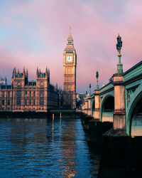 Westminster bridge over thames river against big ben