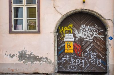 Graffiti on wall of old building