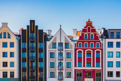 Residential buildings against blue sky