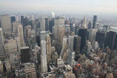 High angle view of modern buildings in city against sky