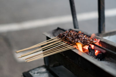 Close-up of meat on barbecue grill