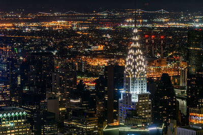 Aerial view of city lit up at night