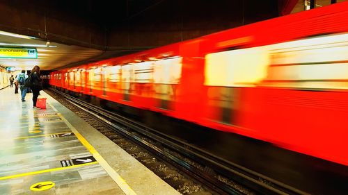 Blurred motion of train at railroad station