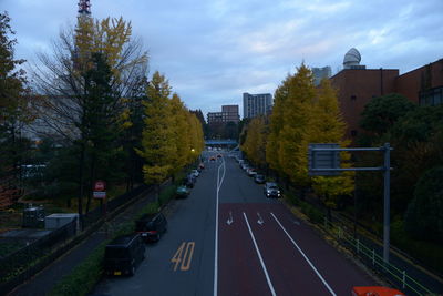 Vehicles on road along buildings in tokyo 