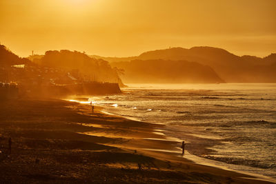 Scenic view of sea against sky during sunrise