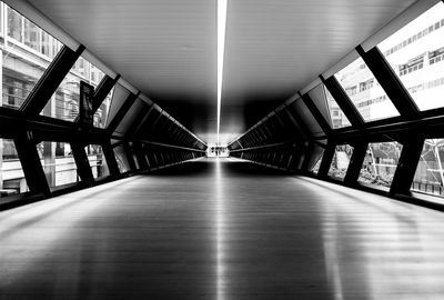 Empty illuminated corridor of building