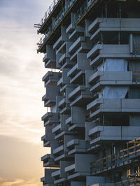 Low angle view of building against sky during sunset