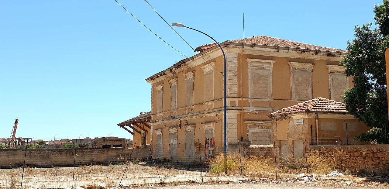 ABANDONED BUILDING AGAINST CLEAR SKY