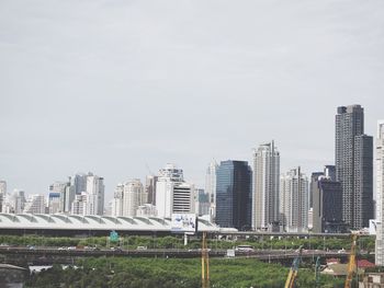 Skyscrapers in city against sky