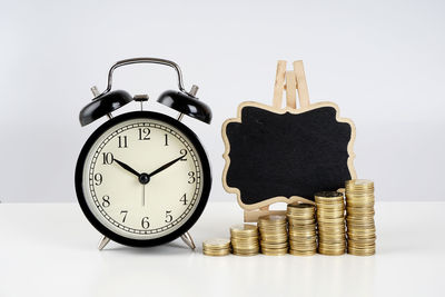 Close-up of clock tower against white background