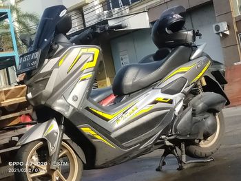 High angle view of motor scooter parked on road