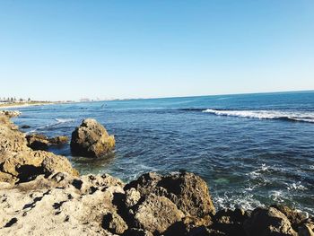 Scenic view of sea against clear sky