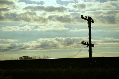 Field against cloudy sky