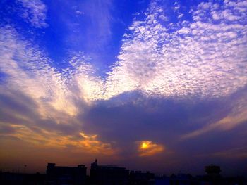 Low angle view of cloudy sky at sunset
