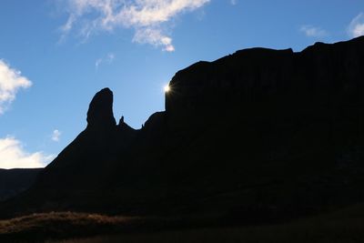 Low angle view of silhouette mountain against sky