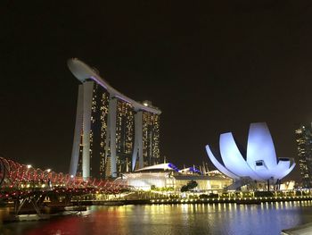 Illuminated city at waterfront