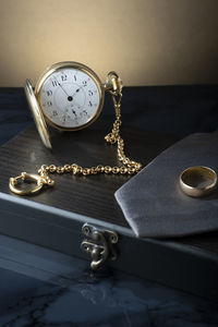 High angle view of clock on table