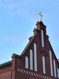 Low angle view of bell tower against sky