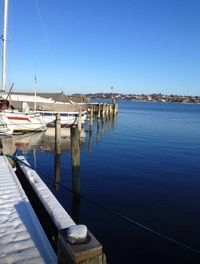 Boats moored at harbor