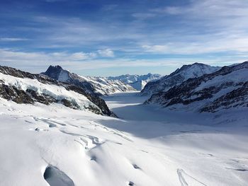 Scenic view of mountains against sky during winter