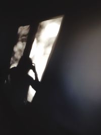 Close-up of woman in dark room