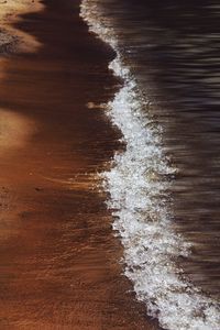 High angle view of surf on beach