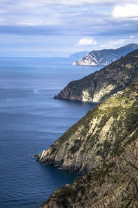 Scenic view of sea and mountains against sky, cinque terre, italy 