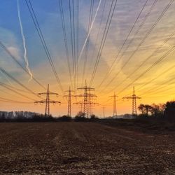 Electricity pylon on field