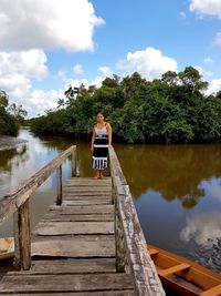 Pier amidst lake against sky