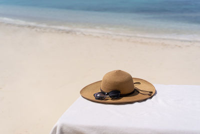 Close-up of hat on beach